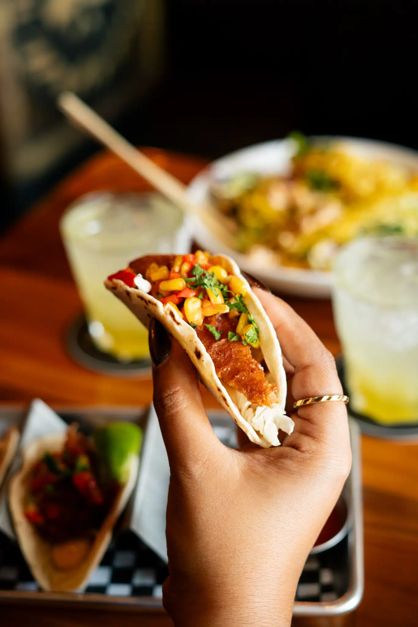 Close-up of a taco served with margaritas and share plates at Warehouse.