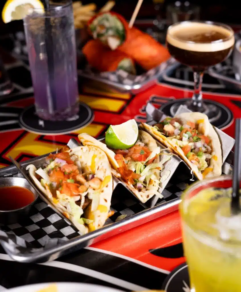 An image of delicious tacos and drinks at the table in Warehouse. 