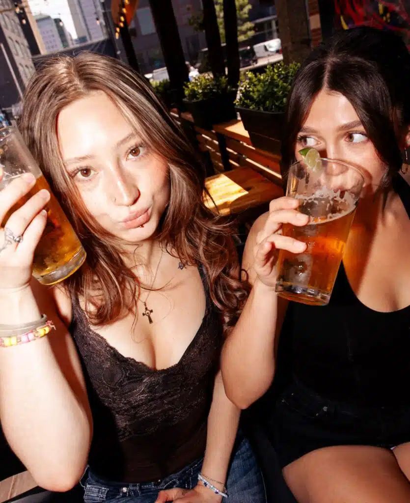  Two women enjoying the drinks at Warehouse, Alberta. 