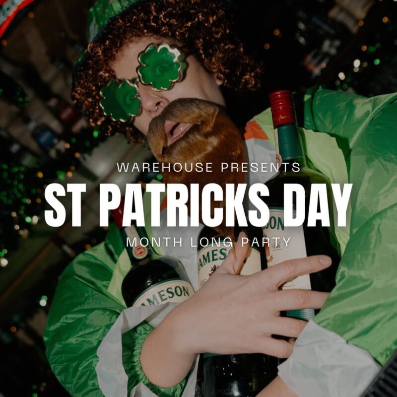 A man in St. Patrick’s Day attire holding Jameson bottles at Warehouse