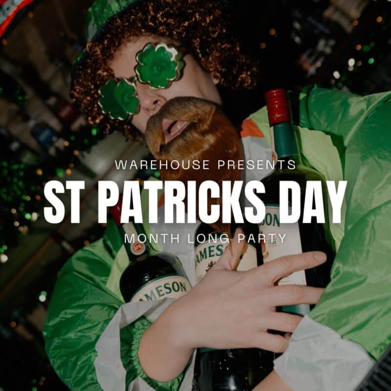 A man dressed in the St. Patrick’s Day theme holding bottles of Jameson at Warehouse.