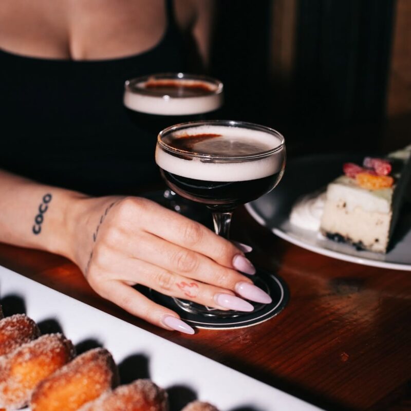 Plate of mini donuts and cocktails served at Warehouse table